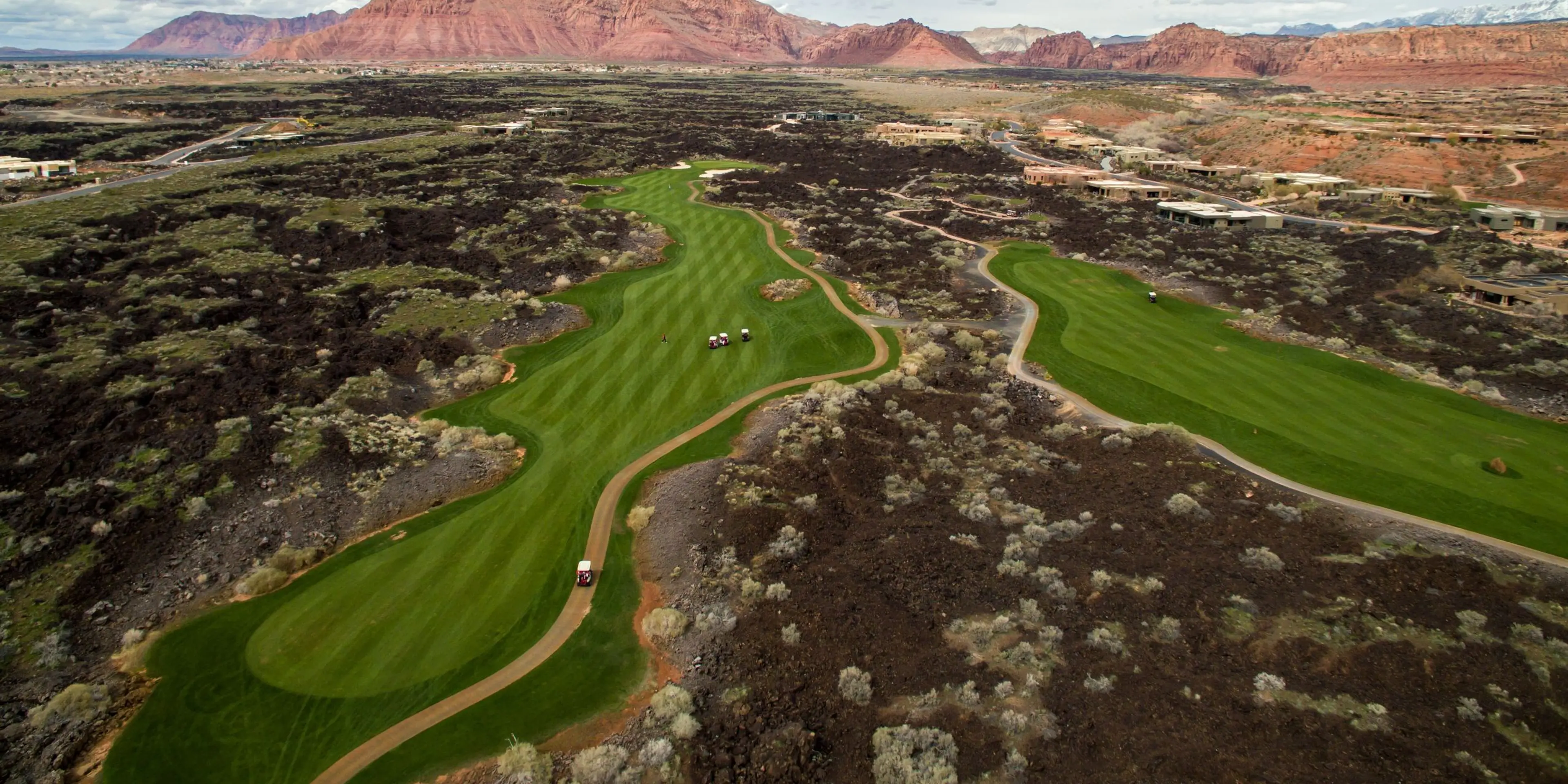Entrada fairway framed by red rock canyon walls